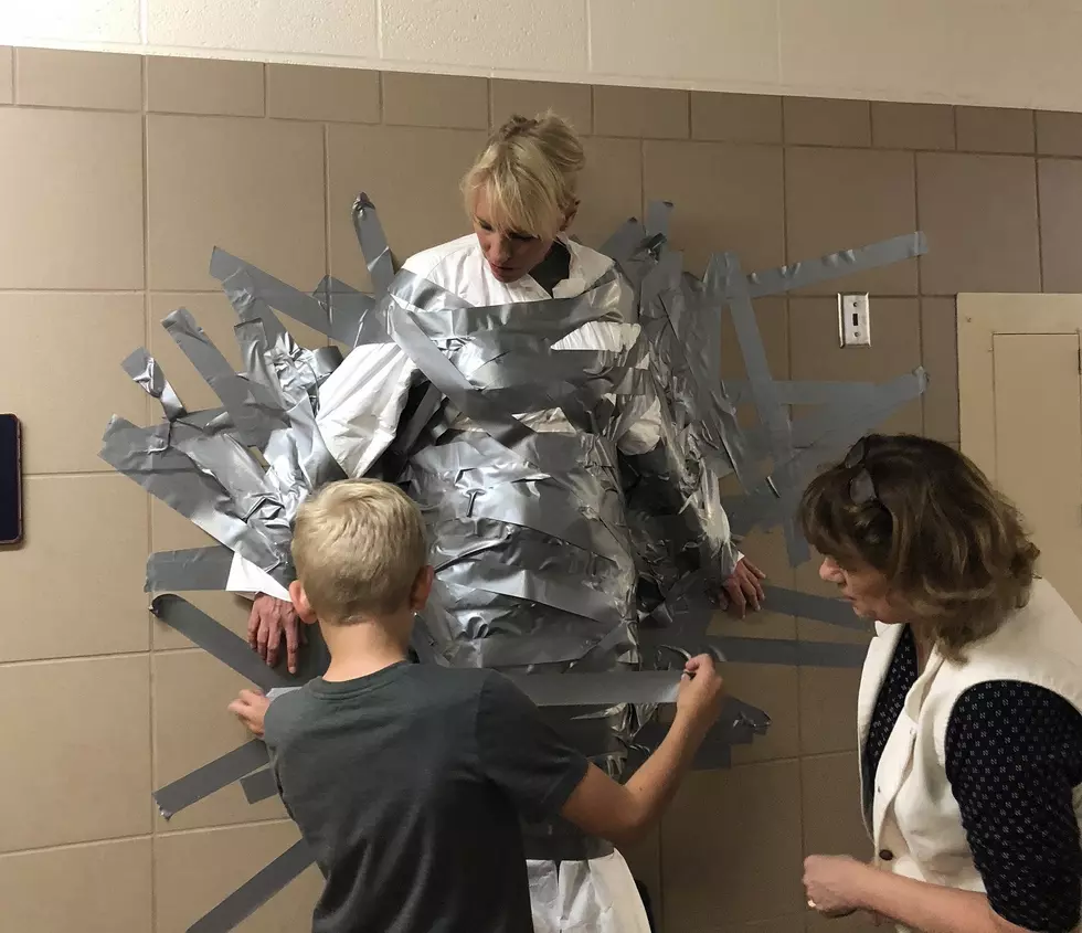 St. Mary’s Students Reach Marathon Goal, Duct Tape Their Principal to the Wall